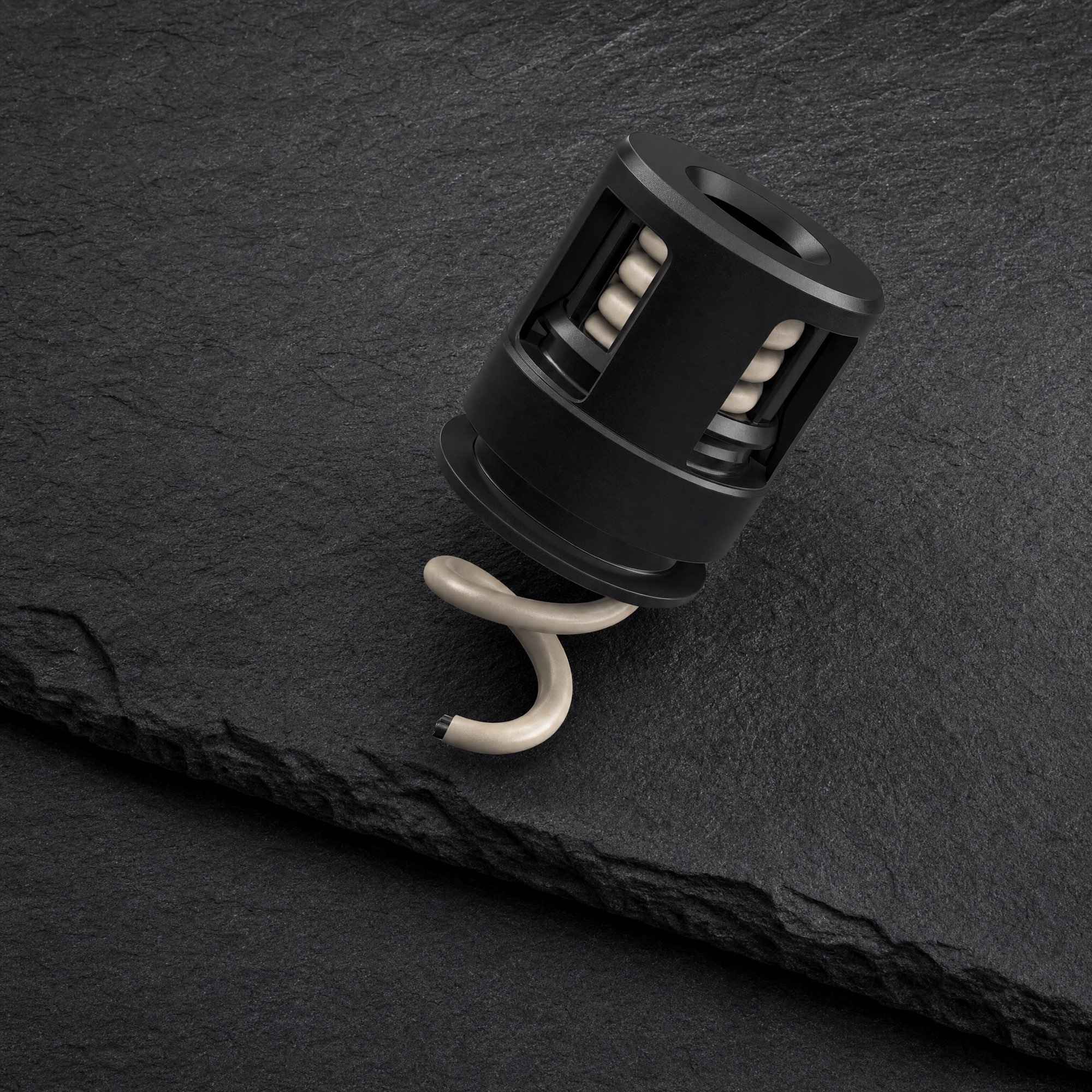 The Syn-R1 electrode on dark slate, seen from above